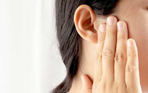 Woman-Pressing-Ear