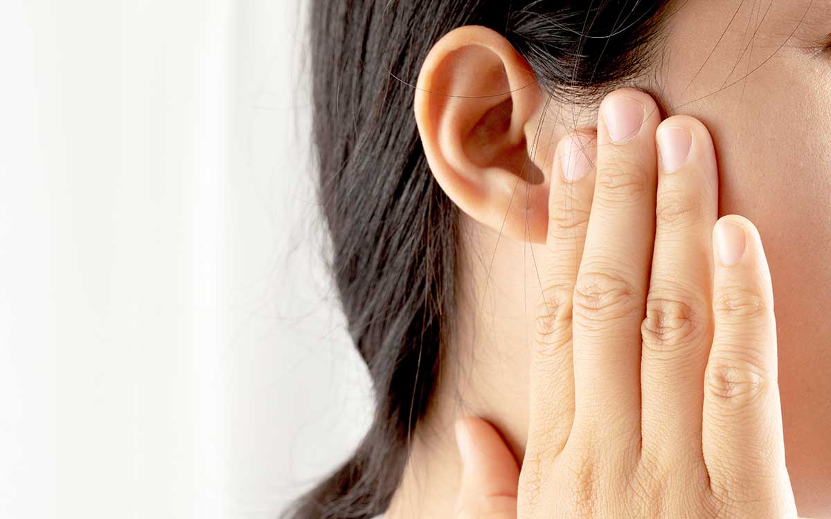 Woman-Pressing-Ear